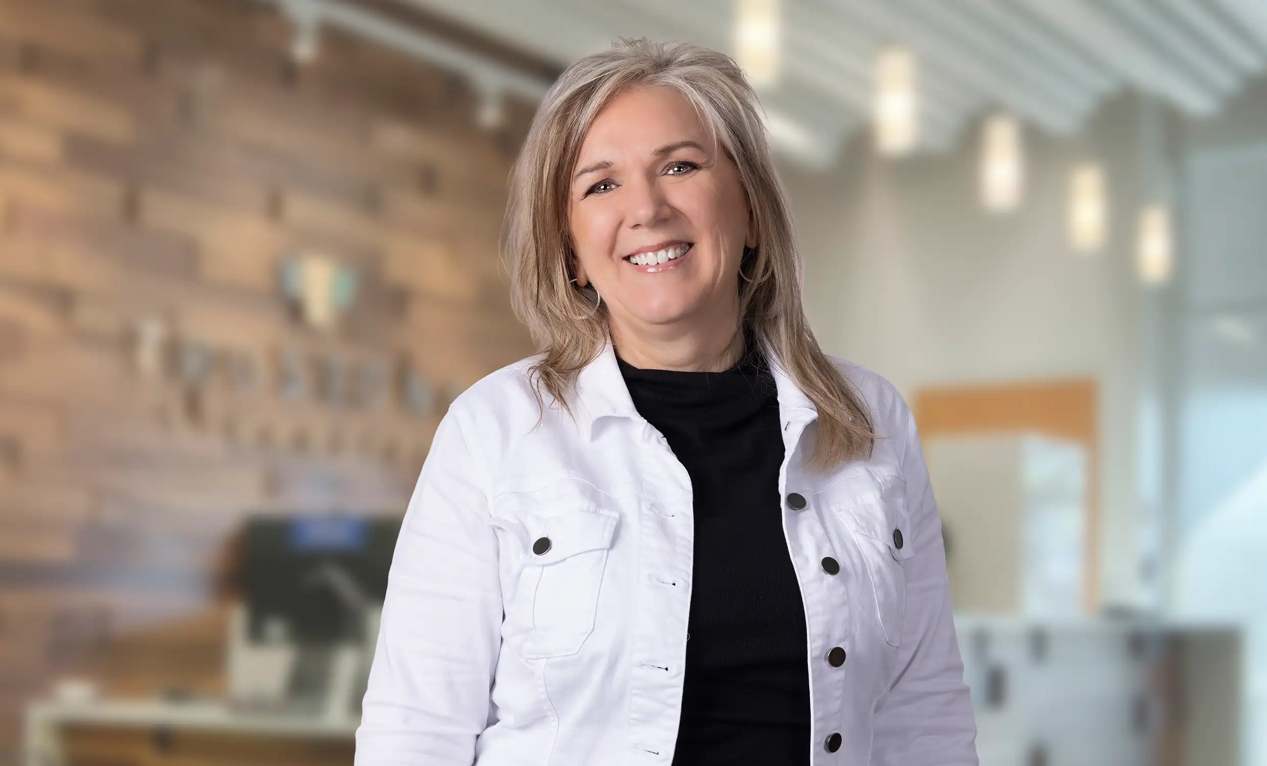 Diane smiling in an office setting