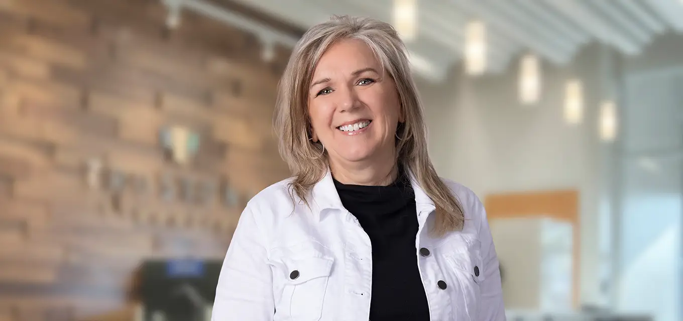 Diane smiling in an office setting