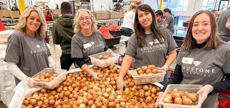 TruStone Financial employees volunteering at a food pantry